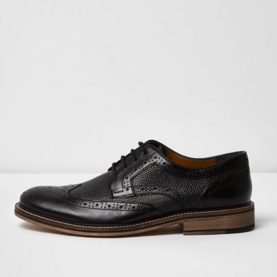 Black textured leather brogues